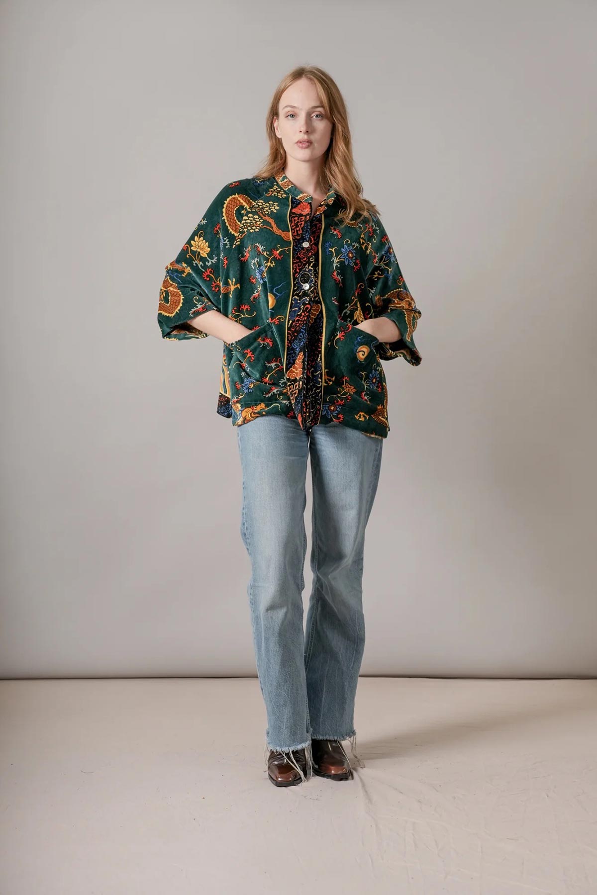 Model wearing dragon green velvet jacket print by One Hundred Stars – available at Urban Wild