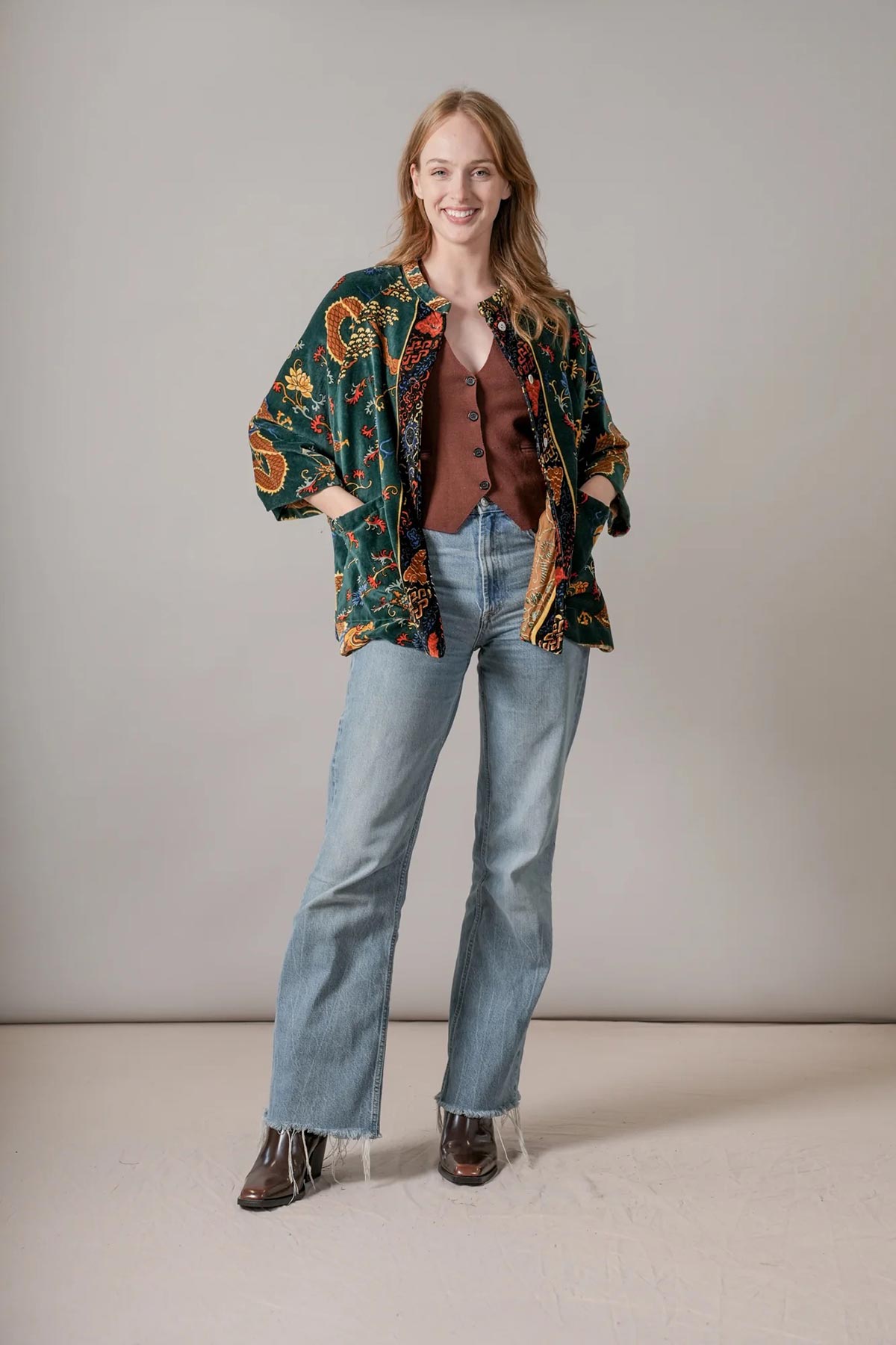 Model wearing dragon green velvet jacket print by One Hundred Stars – available at Urban Wild