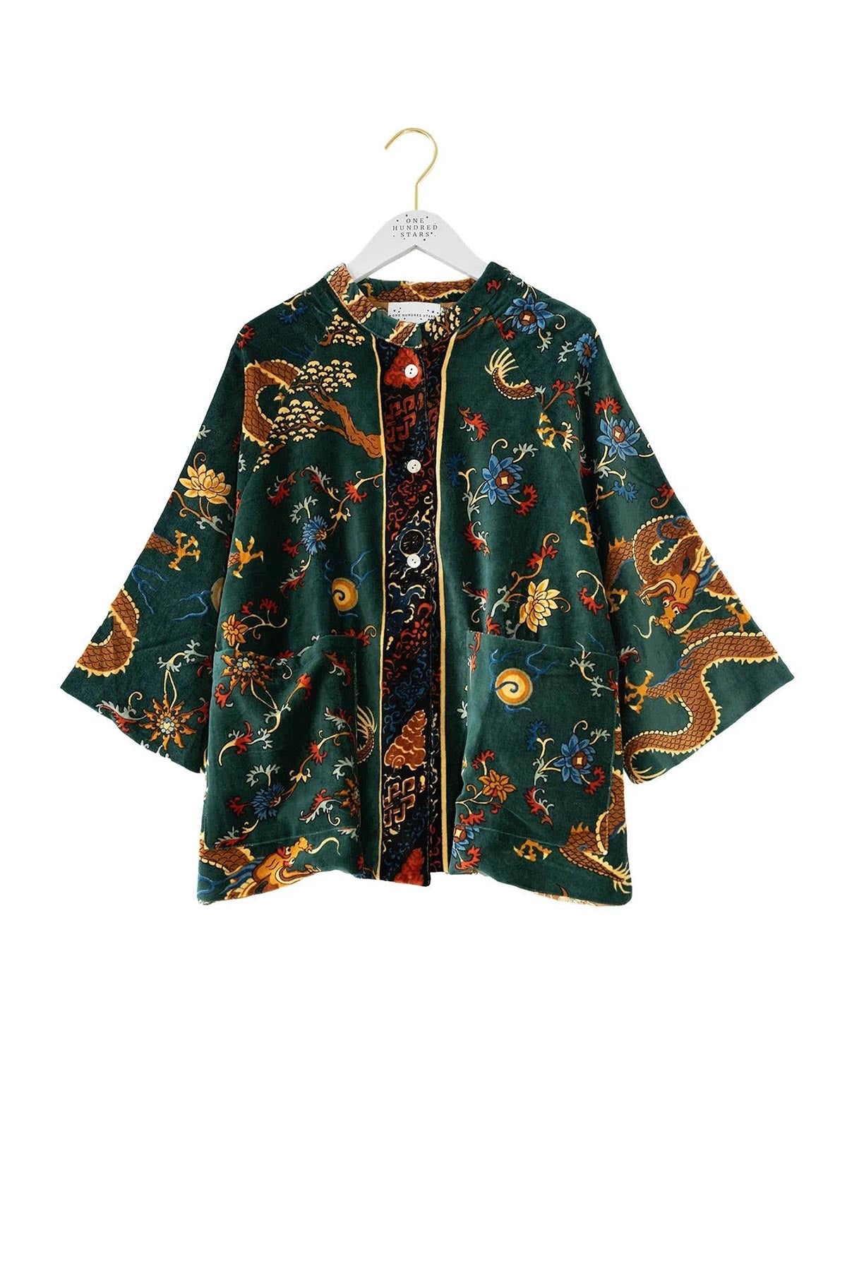 Close-up detail of dragon green print jacket by One Hundred Stars – available at Urban Wild